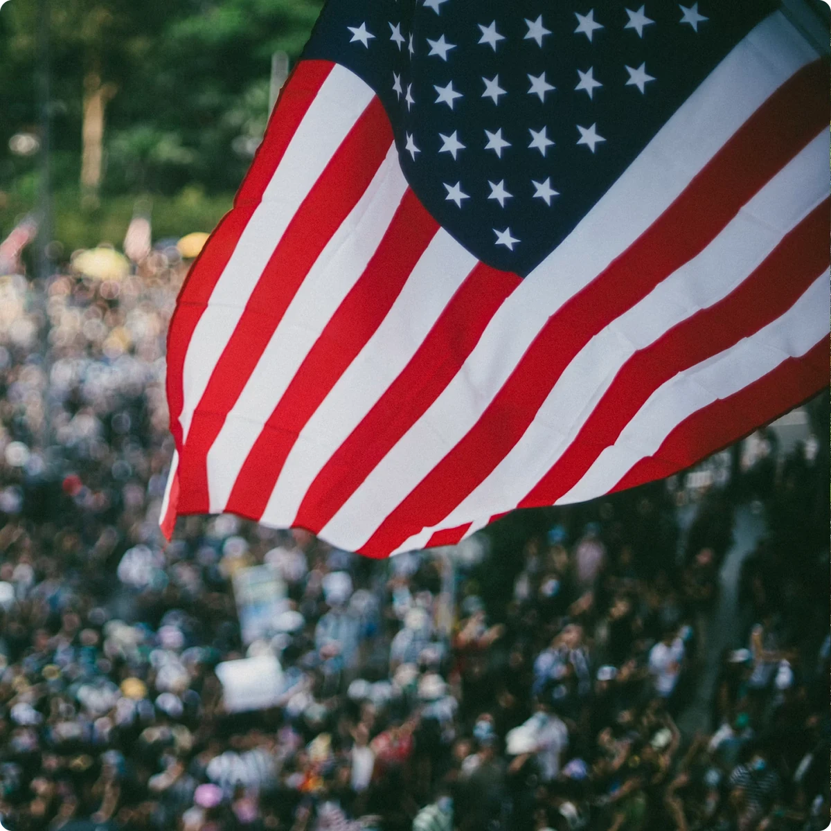 American flag above a crowd
